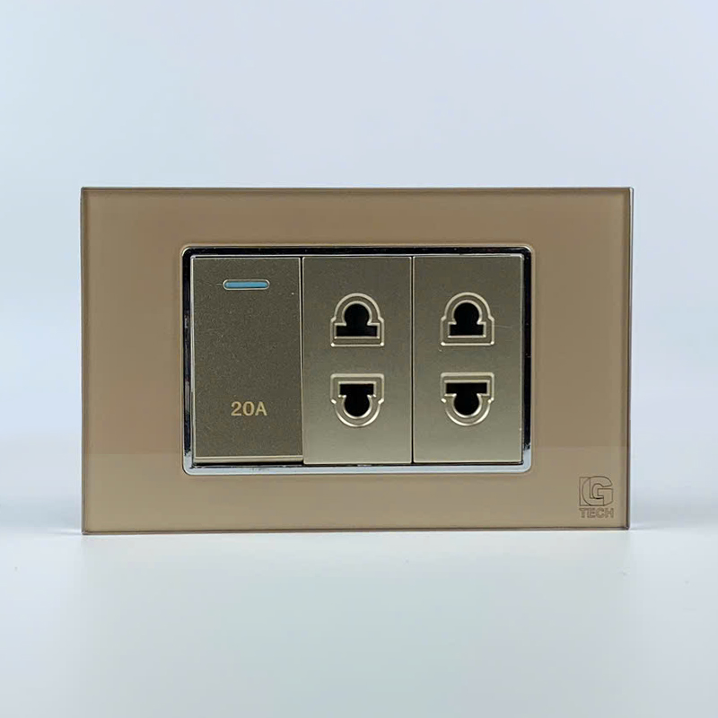 Mô đun công tắc 20A và 2 ổ cắm 2 chấu, size 24mm viền kính màu gold LG Tech 1 Mô đun công tắc 20A và 2 ổ cắm 2 chấu, size 24mm viền kính màu gold LG Tech